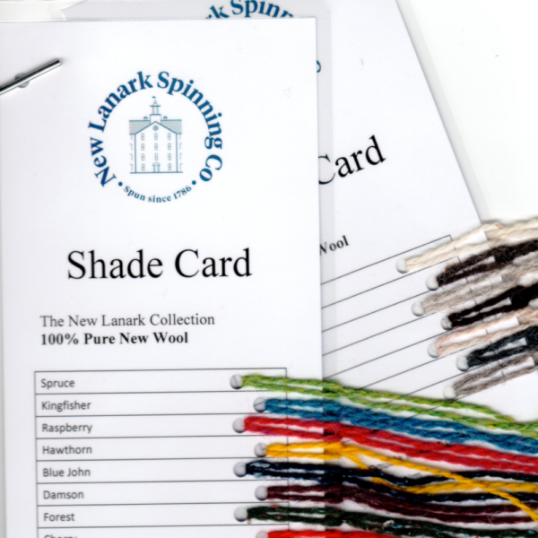 Shade Card – New Lanark Spinning Co. Wool 4.8/2 Nm New Lanark Spinning Co. Shade Card. Image shows two punched laminated cards with strands of wool knotted on them.